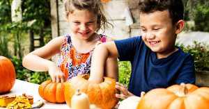 kids carving pumpkins