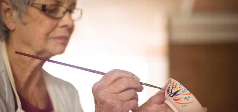 senior woman painting